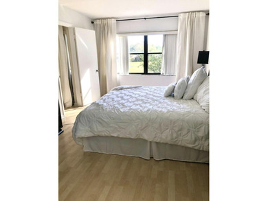 Beautifully updated second floor condo offers sweeping golf on Old Marsh Golf Club in Florida - for sale on GolfHomes.com, golf home, golf lot