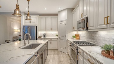 Welcome to resort-style living in Esplanade Azario at Lakewood on Esplanade Golf and Country at Lakewood Ranch in Florida - for sale on GolfHomes.com, golf home, golf lot