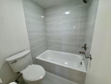 Beautifully updated second floor condo offers sweeping golf on Old Marsh Golf Club in Florida - for sale on GolfHomes.com, golf home, golf lot