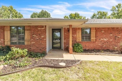 Red brick ranch style home with cedar accents located in Surrey on Golf Club At Surrey Hills in Oklahoma - for sale on GolfHomes.com, golf home, golf lot