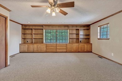 Red brick ranch style home with cedar accents located in Surrey on Golf Club At Surrey Hills in Oklahoma - for sale on GolfHomes.com, golf home, golf lot