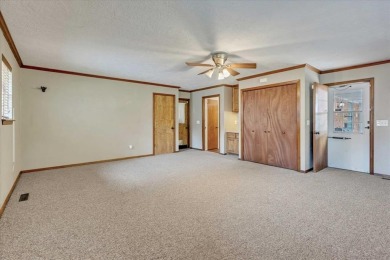 Red brick ranch style home with cedar accents located in Surrey on Golf Club At Surrey Hills in Oklahoma - for sale on GolfHomes.com, golf home, golf lot