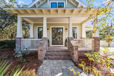 Tucked away on a quiet cul-de-sac, surrounded by magnolias and on Santa Rosa Golf and Beach Club in Florida - for sale on GolfHomes.com, golf home, golf lot