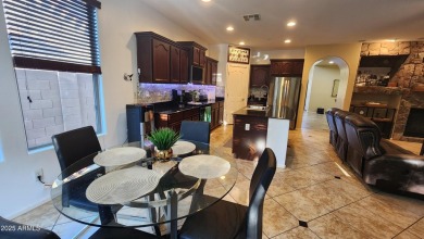 This beautifully maintained 4-bedroom, 3-bath home--with a on Blackstone Country Club in Arizona - for sale on GolfHomes.com, golf home, golf lot