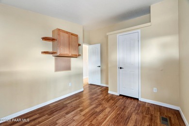 Set on a generous corner homesite in the desirable 55+ Villages on Quail Wood Greens Golf Course in Arizona - for sale on GolfHomes.com, golf home, golf lot