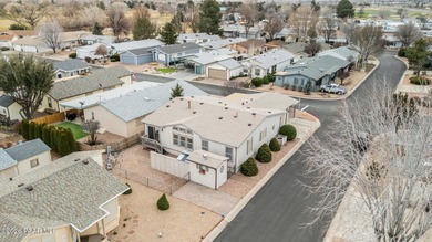 Set on a generous corner homesite in the desirable 55+ Villages on Quail Wood Greens Golf Course in Arizona - for sale on GolfHomes.com, golf home, golf lot