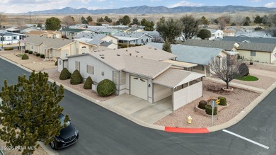 Set on a generous corner homesite in the desirable 55+ Villages on Quail Wood Greens Golf Course in Arizona - for sale on GolfHomes.com, golf home, golf lot