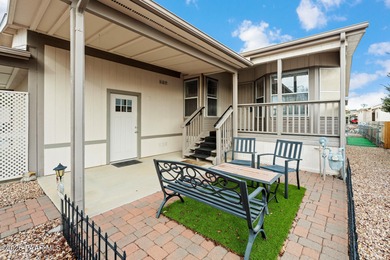 Set on a generous corner homesite in the desirable 55+ Villages on Quail Wood Greens Golf Course in Arizona - for sale on GolfHomes.com, golf home, golf lot