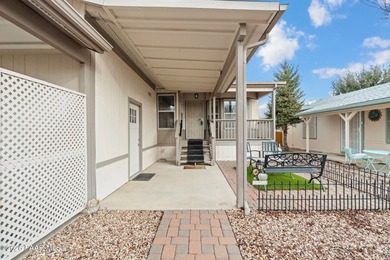 Set on a generous corner homesite in the desirable 55+ Villages on Quail Wood Greens Golf Course in Arizona - for sale on GolfHomes.com, golf home, golf lot