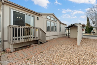 Set on a generous corner homesite in the desirable 55+ Villages on Quail Wood Greens Golf Course in Arizona - for sale on GolfHomes.com, golf home, golf lot