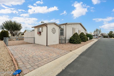 Set on a generous corner homesite in the desirable 55+ Villages on Quail Wood Greens Golf Course in Arizona - for sale on GolfHomes.com, golf home, golf lot