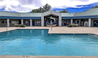 Set on a generous corner homesite in the desirable 55+ Villages on Quail Wood Greens Golf Course in Arizona - for sale on GolfHomes.com, golf home, golf lot