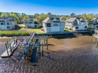 Step into luxurious waterfront living in the prestigious on Tidewater Golf Club and Plantation in South Carolina - for sale on GolfHomes.com, golf home, golf lot
