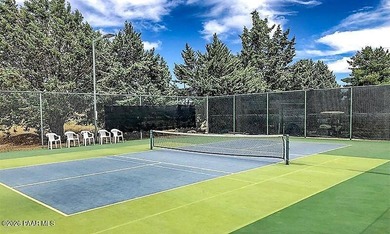 Set on a generous corner homesite in the desirable 55+ Villages on Quail Wood Greens Golf Course in Arizona - for sale on GolfHomes.com, golf home, golf lot