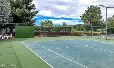 Set on a generous corner homesite in the desirable 55+ Villages on Quail Wood Greens Golf Course in Arizona - for sale on GolfHomes.com, golf home, golf lot