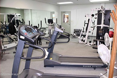 Set on a generous corner homesite in the desirable 55+ Villages on Quail Wood Greens Golf Course in Arizona - for sale on GolfHomes.com, golf home, golf lot