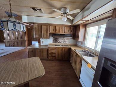 Spacious Mesa home offering a comfortable floor plan, generous on Fountain of the Sun Country Club in Arizona - for sale on GolfHomes.com, golf home, golf lot