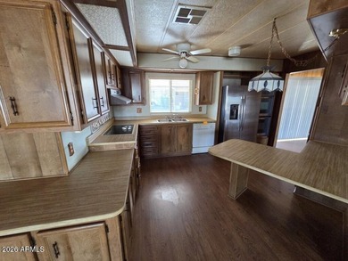 Spacious Mesa home offering a comfortable floor plan, generous on Fountain of the Sun Country Club in Arizona - for sale on GolfHomes.com, golf home, golf lot