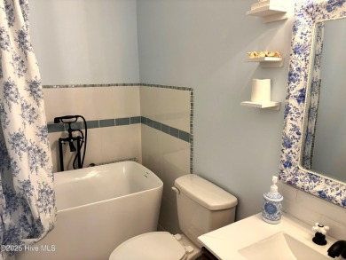 This beautifully updated two-bedroom, two-bath second-floor on Minnesott Golf and Country Club in North Carolina - for sale on GolfHomes.com, golf home, golf lot