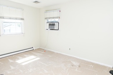 This traditional, split-level home is freshly painted just on The Links At Brigantine Beach in New Jersey - for sale on GolfHomes.com, golf home, golf lot