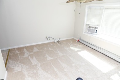 This traditional, split-level home is freshly painted just on The Links At Brigantine Beach in New Jersey - for sale on GolfHomes.com, golf home, golf lot
