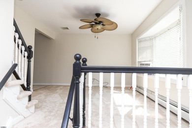 This traditional, split-level home is freshly painted just on The Links At Brigantine Beach in New Jersey - for sale on GolfHomes.com, golf home, golf lot