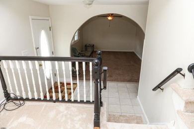 This traditional, split-level home is freshly painted just on The Links At Brigantine Beach in New Jersey - for sale on GolfHomes.com, golf home, golf lot