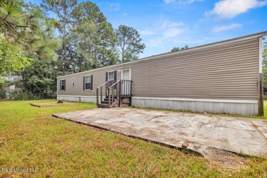 Charming 3-bedroom, 2-bath home nestled in the heart of Gautier on Mississippi National Golf Course in Mississippi - for sale on GolfHomes.com, golf home, golf lot