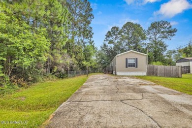 Charming 3-bedroom, 2-bath home nestled in the heart of Gautier on Mississippi National Golf Course in Mississippi - for sale on GolfHomes.com, golf home, golf lot