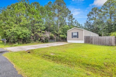 Charming 3-bedroom, 2-bath home nestled in the heart of Gautier on Mississippi National Golf Course in Mississippi - for sale on GolfHomes.com, golf home, golf lot