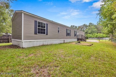 Charming 3-bedroom, 2-bath home nestled in the heart of Gautier on Mississippi National Golf Course in Mississippi - for sale on GolfHomes.com, golf home, golf lot