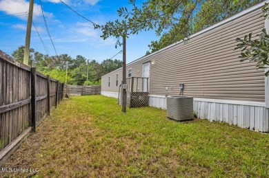 Charming 3-bedroom, 2-bath home nestled in the heart of Gautier on Mississippi National Golf Course in Mississippi - for sale on GolfHomes.com, golf home, golf lot