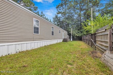 Charming 3-bedroom, 2-bath home nestled in the heart of Gautier on Mississippi National Golf Course in Mississippi - for sale on GolfHomes.com, golf home, golf lot