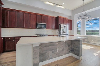 Beautifully Updated Estate Home with Scenic Lake View! This on Valencia Golf and Country Club in Florida - for sale on GolfHomes.com, golf home, golf lot