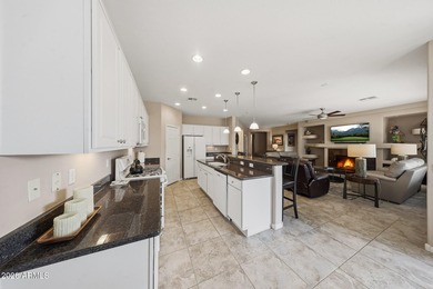 Welcome home to this beautifully upgraded Newport model, nestled on Tuscany Falls At Pebble Creek in Arizona - for sale on GolfHomes.com, golf home, golf lot