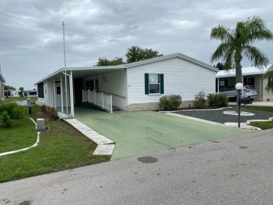 This home stands out from the rest. Three bedrooms, two baths on Sabal Springs Golf and Racquet Club in Florida - for sale on GolfHomes.com, golf home, golf lot