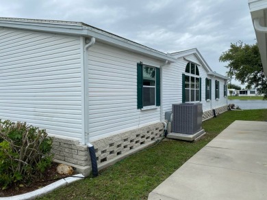 This home stands out from the rest. Three bedrooms, two baths on Sabal Springs Golf and Racquet Club in Florida - for sale on GolfHomes.com, golf home, golf lot