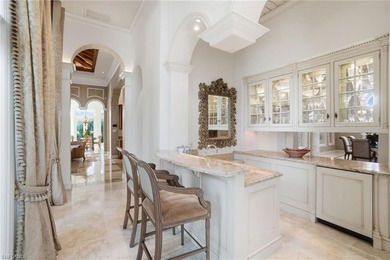 Experience true luxury living on one of the most premier lake on Quail West Golf and Country Club in Florida - for sale on GolfHomes.com, golf home, golf lot