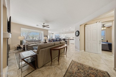 Welcome home to this beautifully upgraded Newport model, nestled on Tuscany Falls At Pebble Creek in Arizona - for sale on GolfHomes.com, golf home, golf lot