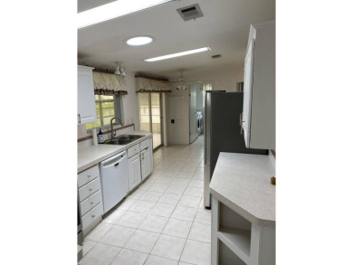This home stands out from the rest. Three bedrooms, two baths on Sabal Springs Golf and Racquet Club in Florida - for sale on GolfHomes.com, golf home, golf lot