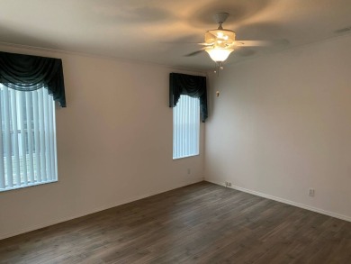 This home stands out from the rest. Three bedrooms, two baths on Sabal Springs Golf and Racquet Club in Florida - for sale on GolfHomes.com, golf home, golf lot