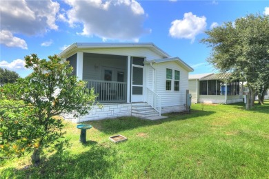 Enjoy direct golf course and water views from this beautifully on Barefoot Bay Golf Course in Florida - for sale on GolfHomes.com, golf home, golf lot