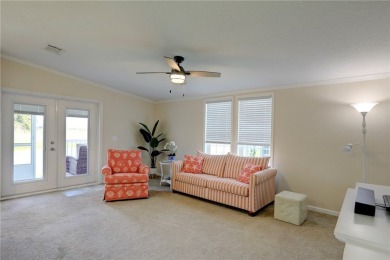 Enjoy direct golf course and water views from this beautifully on Barefoot Bay Golf Course in Florida - for sale on GolfHomes.com, golf home, golf lot