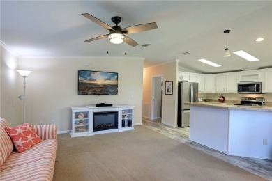 Enjoy direct golf course and water views from this beautifully on Barefoot Bay Golf Course in Florida - for sale on GolfHomes.com, golf home, golf lot