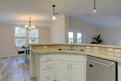 Enjoy direct golf course and water views from this beautifully on Barefoot Bay Golf Course in Florida - for sale on GolfHomes.com, golf home, golf lot