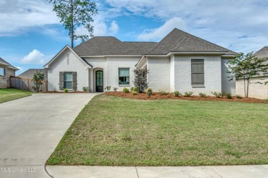 Better than new. This home has barely been lived in. Great open on Lake Caroline Golf Club in Mississippi - for sale on GolfHomes.com, golf home, golf lot