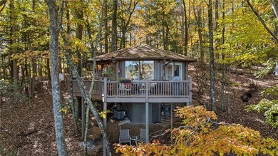 Experience tranquility and breathtaking views at this on Big Canoe Golf Club - Cherokee in Georgia - for sale on GolfHomes.com, golf home, golf lot