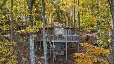 Experience tranquility and breathtaking views at this on Big Canoe Golf Club - Cherokee in Georgia - for sale on GolfHomes.com, golf home, golf lot