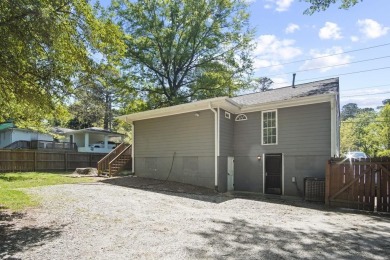 Discover this charming updated home with an incredible view of on John A. White Golf Course in Georgia - for sale on GolfHomes.com, golf home, golf lot