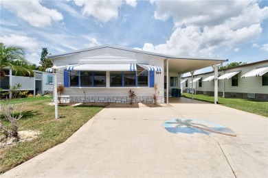 I LOVE THIS HOME! Over 1,300 sq. ft. of comfort and charm. Enjoy on Barefoot Bay Golf Course in Florida - for sale on GolfHomes.com, golf home, golf lot